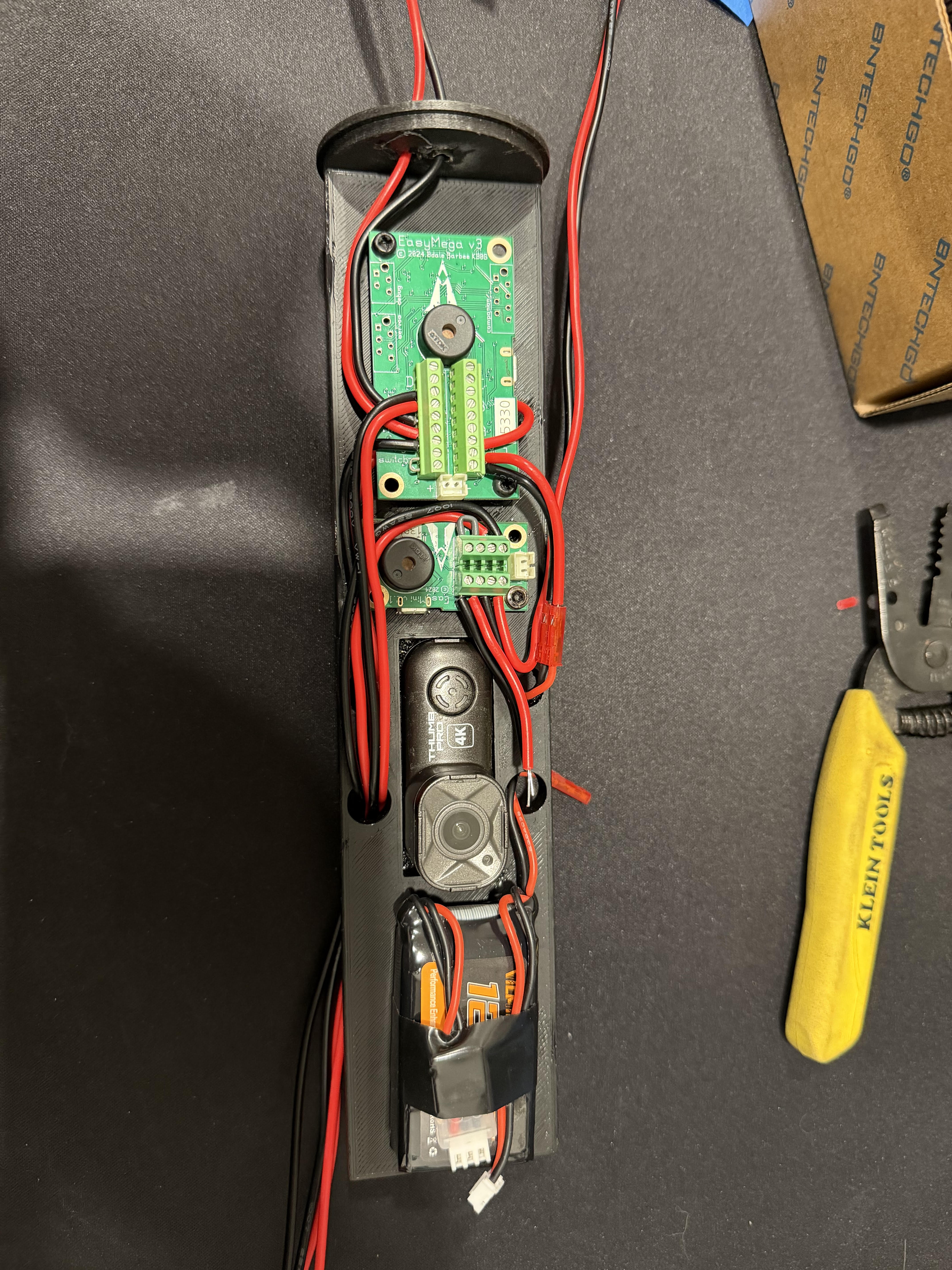 Assembled avionics bay sled with flight computer, camera, and battery wired in